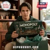 Starbucks Monopoly Collector Edition Board Game box held by a young man sitting in a brown leather chair.