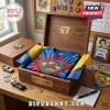 Superman Autism Awareness shirt with a puzzle piece logo inside a wooden keepsake box on a desk with comic books.