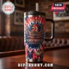 Sydney Roosters 118th Anniversary YETI Tumbler with red, white, and blue tie-dye graphics and official club logo on a desk.