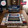 Tennessee Titans Monopoly Collector Edition board game set featuring Nissan Stadium graphics, game pieces, and currency.