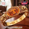 Tennessee Volunteers Gold Plated Mascot Hinged Bracelet featuring an orange oval center, T logo, and dog reliefs.