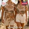 Texas Longhorns Bevo Mascot Hawaiian shirt featuring a beach scene, palm trees, and the team logo in tan and brown tones.