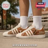 Texas Longhorns Burnt Orange Leather Sneakers with white stripes and team graphics on a tan background.