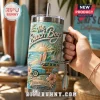The Beach Boys 40oz YETI Tumbler With Handle features a woodie wagon, surfboards, and palm tree art on a teal background.
