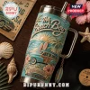 The Beach Boys 40oz YETI Tumbler With Handle features a teal surf scene, woody wagon, sunset, and Good Vibrations text.