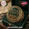 The Chosen 7th Anniversary Crystal Ring featuring a deep green center, gold metallic detail, and biblical scene engraving.