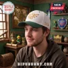 The Legend of Zelda Triforce Embroidered Cap in cream with a dark green brim, featuring a gold Triforce logo and text.