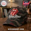 The Rolling Stones Camouflage Classic Cap featuring the iconic red tongue logo and white script on a dark camo fabric.