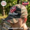 The Rolling Stones Camouflage Classic Cap featuring the iconic red lips logo on a green, brown, and black camo base.