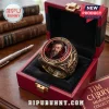 Tim Curry In Loving Memory 1946-2026 Ring featuring a portrait, gold-toned metal, and red accent stones in a red jewelry box.