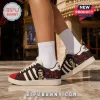 Tim Curry Rocky Horror Memorial Edition Casual Shoes featuring Dr. Frank-N-Furter graphics, red roses, and black stripes.