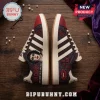 Tim Curry Rocky Horror Memorial Edition Casual Shoes featuring portrait art, lip motifs, and floral patterns on a wood floor.