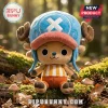 Tony Tony Chopper One Piece stuffed plush toy wearing a blue hat with a white X, sitting on forest moss and autumn leaves.
