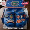 University of Florida Gators Blue Crocs With Charms featuring mascot, football helmet, and university logo emblems.