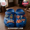 University of Florida Gators blue Crocs with charms featuring team logos, football helmets, and festive holiday mascots.