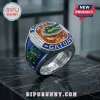 University of Florida Gators Championship Ring with orange stone, blue enamel, and Gator mascot logo on black marble.