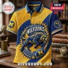 University of Michigan Wolverines Textured Polo Shirt in maize and blue with a central wolverine graphic and team logos.