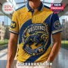 University of Michigan Wolverines Textured Polo Shirt featuring a blue and yellow pattern with a central wolverine graphic.
