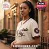 Washington Nationals Chocolate City African Heritage Baseball Jersey in cream with brown accents on a female model.