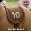 Wild Pony Cute Plush Pillow featuring a tan fabric surface with a stitched brown saddle patch displaying the number 10.