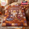 Winnie the Pooh and Friends Halloween Bed Quilt 2026 featuring characters in costumes on a patchwork orange and purple background.