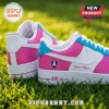 WNBA All Teams Barbie Edition Custom Air Force 1 Sneakers in pink, white, and teal sitting on bright green grass.