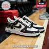 WNBA Skyline Edition Custom Nike Air Force 1 sneakers featuring black, white, and gold colors on a hardwood basketball court.