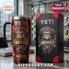 Yeti Georgia Bulldogs 241st Anniversary Tie-Dye Stanley Tumbler with mascot logo and Sanford Stadium graphic on desk.