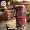 Yeti Ohio State Buckeyes 136th Anniversary YETI Tumbler with red, gray, and black team logos held by a hand outdoors.