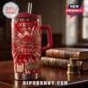 Yeti Sydney Swans 152nd Anniversary Tie-Dye Stanley Tumbler in red and white with team logo and stadium graphic on table.
