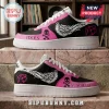 Yungblud Idols Skull Wings Air Force 1 Sneakers in black and pink with white wing graphics on a marble surface.