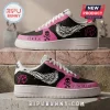 Yungblud Idols Skull Wings Air Force 1 Sneakers in black and pink with white wings and skull graphics on a stone base.