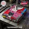 Yungblud Punk Rock Patchwork T-Shirt featuring Union Jack, cassette tape, guitar, and safety pin graphics on a metal table.