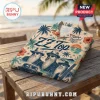 ZZ Top Sharp Dressed Man Hawaiian shirt featuring the band members, palm trees, and sunset on a beige tropical fabric.