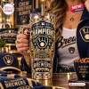 Close-up of a blue and gold 40oz tumbler with a gem-encrusted handle and 2026 Milwaukee Brewers Champions graphics.