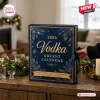 2026 Vodka Advent Calendar featuring a navy blue box with gold snowflake patterns on a wooden table.