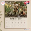 Front view of March 2027 page for Funny Yorkshire Terrier Wall Calendar featuring a muddy puppy wearing garden gloves.