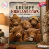 Front view of the 2027 Grumpy Highland Cows Calendar hanging on a wall with five long-haired cattle portraits.