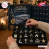 24 Days Of Football Christmas Advent Calendar 2026 box with numbered grid holding metal soccer-themed ornaments on a table.