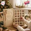 24 Days Of Snowflake Christmas Advent Calendar with gold gift box and decorative holiday ornaments in individual slots.