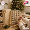 24 Days Of Snowflake Christmas Advent Calendar with gold packaging and individual ornament slots on a wooden table.