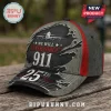 911 We Will Never Forget 25th Anniversary Cap featuring an airplane graphic, text, and red stripe on grey fabric.