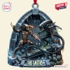 Front view of an Alien Predator Custom Christmas Ornament featuring a battle scene in front of a stone archway.