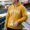 All Team MLB x Childhood Cancer Awareness Hoodie 2026 in mustard yellow with white Astros lettering and ribbon graphics.
