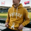All Team MLB x Childhood Cancer Awareness Hoodie 2026 in gold with Astros logo and white awareness ribbon graphic.