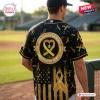 All Team MLB x Childhood Cancer Awareness Month black baseball jersey featuring a gold ribbon pattern and flag graphic.