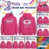 All Team NFL x Crucial Catch Pink Hoodie 2026 showing Green Bay Packers branding with multicolor team logo graphics.
