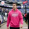 All Team NFL x Crucial Catch Pink Hoodie 2026 worn by a man at a stadium with Ravens logo and Crucial Catch branding.