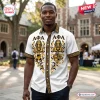 Man wearing an Alpha Phi Alpha Egyptian button down Hawaiian shirt with Greek letters and sphinx motifs, front view.