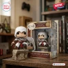 Front view of Altair Ibn-Laahad Assassins Creed 20th Anniversary figure with box on a wooden desk.